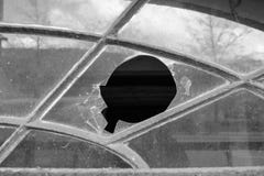 Hole in window in black and white royalty free stock image Hole in window in black and white royalty free stock image