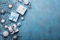 Holiday background with christmas decoration and gift boxes top view. Festive greeting card. Flat lay style. Stock Photos Holiday background with christmas decoration and gift boxes top view. Festive greeting card. Flat lay style. Stock Photos