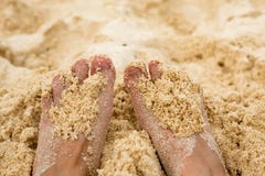 Holiday concept. Woman feet close-up relaxing on beach, enjoying sun and splendid view royalty free stock photos Holiday concept. Woman feet close-up relaxing on beach, enjoying sun and splendid view royalty free stock photos