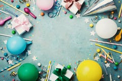 Holiday frame or background with colorful balloon, gift, confetti, silver star, carnival cap, candy and streamer. Flat lay style. royalty free stock images Holiday frame or background with colorful balloon, gift, confetti, silver star, carnival cap, candy and streamer. Flat lay style. royalty free stock images