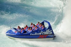Holiday makers people enjoying thrill of jet boat ride Huka Falls, Lake Taupo, New Zealand