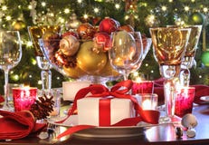 Holiday table setting with red ribbon gift royalty free stock images Holiday table setting with red ribbon gift royalty free stock images