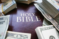 The Holy Bible Surrounded With Non Profit Money