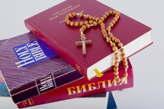 Holy Bible With Rosary On Pile Of Old Books Royalty Free Stock Images