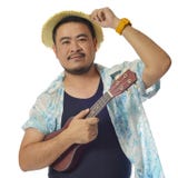 Hombre asiático con el ukelele Imagen de archivo Hombre asiático con el ukelele Imagen de archivo