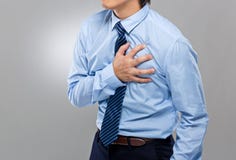 Hombre de negocios con ataque del corazón imagen de archivo libre de regalías Hombre de negocios con ataque del corazón imagen de archivo libre de regalías
