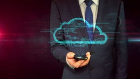 Hombre de negocios con concepto del holograma del smartphone y de la nube Hombre de negocios con concepto del holograma del smartphone y de la nube