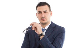 Hombre de negocios o profesor joven que sostiene los vidrios fotografía de archivo Hombre de negocios o profesor joven que sostiene los vidrios fotografía de archivo