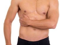 Hombre descamisado muscular con dolor correcto del abdomen imagen de archivo libre de regalías Hombre descamisado muscular con dolor correcto del abdomen imagen de archivo libre de regalías