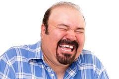 Hombre feliz barbudo caucásico que ríe ruidosamente fotografía de archivo libre de regalías Hombre feliz barbudo caucásico que ríe ruidosamente fotografía de archivo libre de regalías