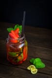 Home-made Mojito with strawberries in a glass jar stock image Home-made Mojito with strawberries in a glass jar stock image