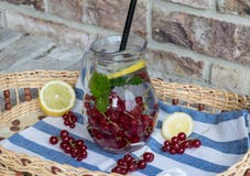 Home-made refreshing lemonade of red currant with ice and lemon royalty free stock photography Home-made refreshing lemonade of red currant with ice and lemon royalty free stock photography