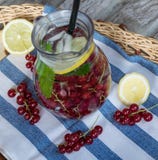 Home-made refreshing lemonade of red currant with ice and lemon royalty free stock photo Home-made refreshing lemonade of red currant with ice and lemon royalty free stock photo