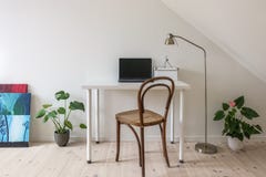 Home office. Vintage chair at white desk with laptop computer. stock image Home office. Vintage chair at white desk with laptop computer. stock image
