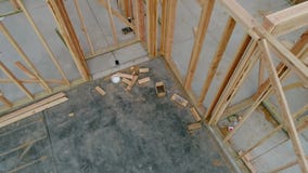 Home under construction with wood studs for walls