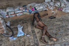 Homeless lies on the sidewalk Royalty Free Stock Photo Homeless lies on the sidewalk Royalty Free Stock Photo