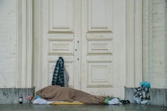 Homeless people sleeping in front of the Saint Jacques-sur-Coudenberg church royalty free stock photo Homeless people sleeping in front of the Saint Jacques-sur-Coudenberg church royalty free stock photo