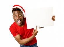Homem afro-americano preto no espaço feliz de sorriso da cópia do quadro de avisos da placa da exibição do chapéu de Santa do Nat imagem de stock Homem afro-americano preto no espaço feliz de sorriso da cópia do quadro de avisos da placa da exibição do chapéu de Santa do Nat imagem de stock