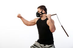 Homem atlético com nunchaks fotografia de stock royalty free Homem atlético com nunchaks fotografia de stock royalty free