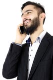 Homem de negócio feliz que fala no telefone imagem de stock Homem de negócio feliz que fala no telefone imagem de stock