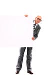 Homem de negócio novo de sorriso feliz que mostra o espaço em branco Fotografia de Stock Royalty Free Homem de negócio novo de sorriso feliz que mostra o espaço em branco Fotografia de Stock Royalty Free