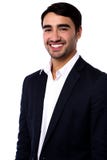 Homem de negócios bem sucedido novo de sorriso imagens de stock royalty free Homem de negócios bem sucedido novo de sorriso imagens de stock royalty free