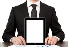Homem de negócios no escritório que guardara a tabuleta com tela isolada fotografia de stock Homem de negócios no escritório que guardara a tabuleta com tela isolada fotografia de stock