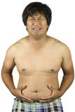 Homem gordo que toca em seu estômago, homem gordo com uma barriga grande isolada no fundo branco fotografia de stock royalty free Homem gordo que toca em seu estômago, homem gordo com uma barriga grande isolada no fundo branco fotografia de stock royalty free