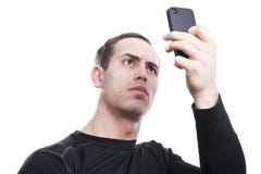 Homem novo com um smartphone fotos de stock Homem novo com um smartphone fotos de stock