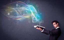 Homem novo que guarda o livro com ondas Imagem de Stock Homem novo que guarda o livro com ondas Imagem de Stock