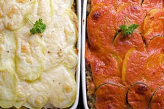 Homemade casseroles with potatoes, minced meat, cheese and zucchini