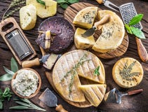 Homemade cheeses on the wooden background. stock images Homemade cheeses on the wooden background. stock images