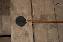 Homemade vintage fly swatter on old boards from above