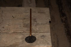 Homemade vintage rubber fly swatter on old boards