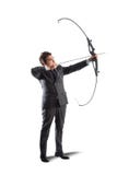 Homme d'affaires avec le tir à l'arc photographie stock Homme d'affaires avec le tir à l'arc photographie stock