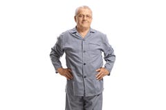 Homme plus âgé dans des pyjamas regardant la caméra photos stock Homme plus âgé dans des pyjamas regardant la caméra photos stock