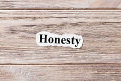 Honesty of the word on paper. concept. Words of Honesty on a wooden background stock image Honesty of the word on paper. concept. Words of Honesty on a wooden background stock image