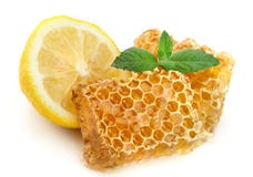 Honey Honeycombs With Lemon Royalty Free Stock Photography Honey Honeycombs With Lemon Royalty Free Stock Photography