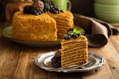 Honey layered cake with candy and berry stock image Honey layered cake with candy and berry stock image