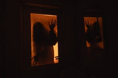 Horror Woman In Window Wood Hand Hold Cage Scary Scene Halloween Concept Blurred Silhouette Of Witch Stock Images Horror Woman In Window Wood Hand Hold Cage Scary Scene Halloween Concept Blurred Silhouette Of Witch Stock Images