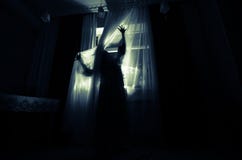 Horror Woman In Window Wood Hand Hold Cage Scary Scene Halloween Concept Blurred Silhouette Of Witch. Selective Focus Royalty Free Stock Image
