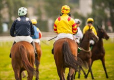 Horse riders on the race track Stock Photos Horse riders on the race track Stock Photos