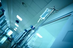 Hospital building corridor with intravenous drip bag on the steel pole, medical background royalty free stock images Hospital building corridor with intravenous drip bag on the steel pole, medical background royalty free stock images