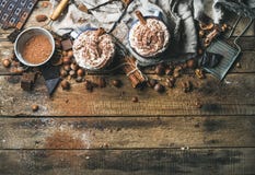 Hot chocolate with whipped cream, nuts, spices and cocoa powder stock photo Hot chocolate with whipped cream, nuts, spices and cocoa powder stock photo