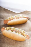 Hot dog grill with mustard, onion and pickles Royalty Free Stock Images Hot dog grill with mustard, onion and pickles Royalty Free Stock Images