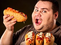 Hot dog konkursu mężczyzna łasowania fasta food Gruby hot dog zdjęcie stock Hot dog konkursu mężczyzna łasowania fasta food Gruby hot dog zdjęcie stock