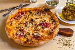 Hot pizza with parma ham, onions and mozarella cheese. Royalty Free Stock Image Hot pizza with parma ham, onions and mozarella cheese. Royalty Free Stock Image