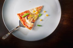 Hot pizza slice with melting cheese on a rustic wooden table. Ho royalty free stock photos Hot pizza slice with melting cheese on a rustic wooden table. Ho royalty free stock photos