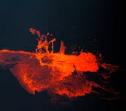 Hot, red, molten lava bubbles to the surface in Hawaii