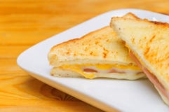 Hot sandwich with ham cheese with wood background stock photography Hot sandwich with ham cheese with wood background stock photography